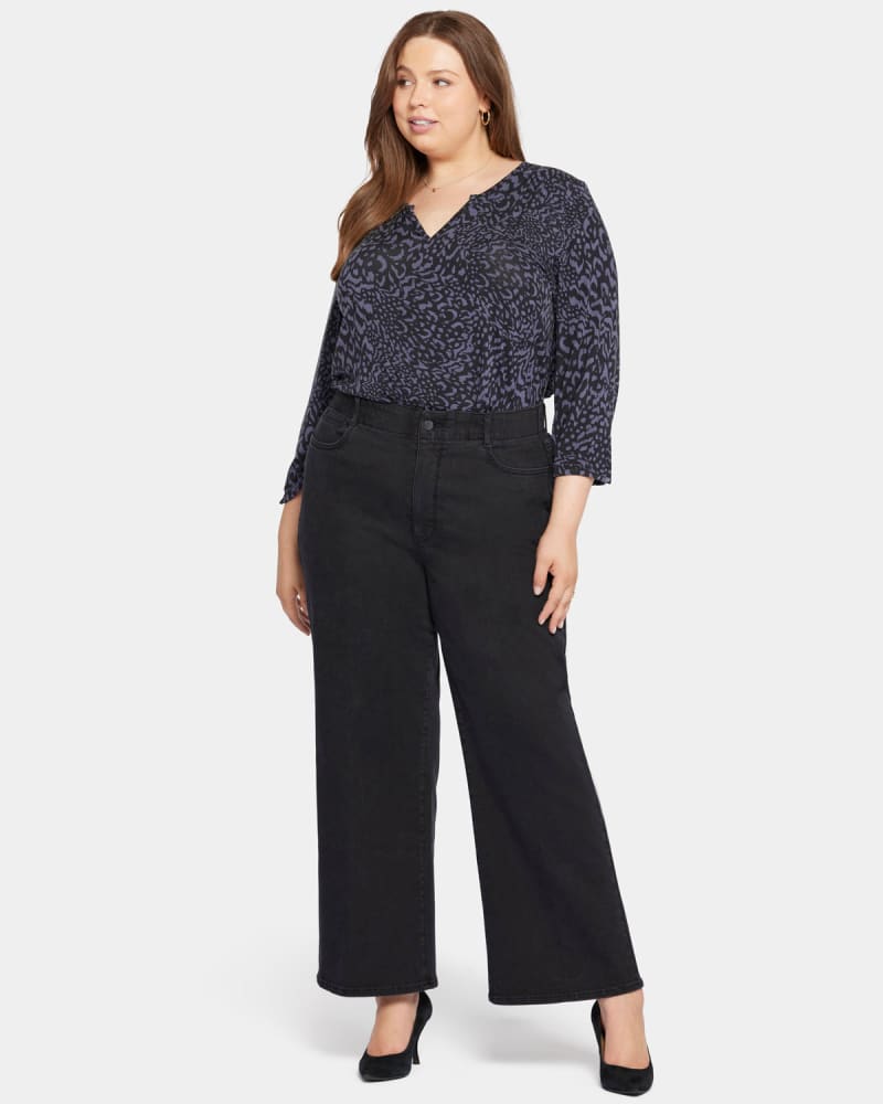 Front of a model wearing a size 0X Marge Wide Leg Jeans in Vintage Black by NYDJ. | dia_product_style_image_id:296172